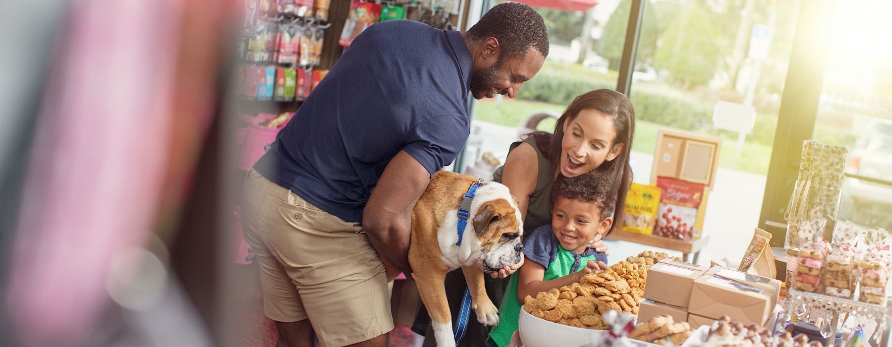 family at dog treat shop